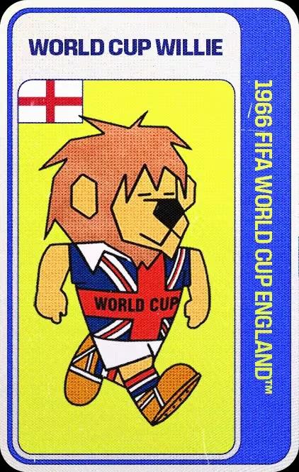 World Cup Willie, mascota oficial del Mundial Inglaterra 1966 que representa un león bípedo de caricatura con botines de futbol y vestido con pantalones cortos blancos y una camisa con la Union Jack (bandera de Gran Bretaña) con la leyenda "World Cup" sobre el pecho.