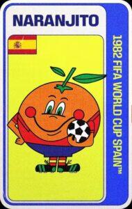 Naranjito, mascota oficial del Mundial España 1982, que representa a una naranja antropomórfica y caricaturesca, vestida con pantaloncillos azules, camisa roja, calcetas de bandas rojas y amarillas, y botines negros con detalles verdes, como los ojos y el palillo y hojas que el fruto tiene en la parte superior de su cuerpo. Naranjito Sonríe ampliamente, y en uno de sus brazos lleva abrazado un balón de fútbol.