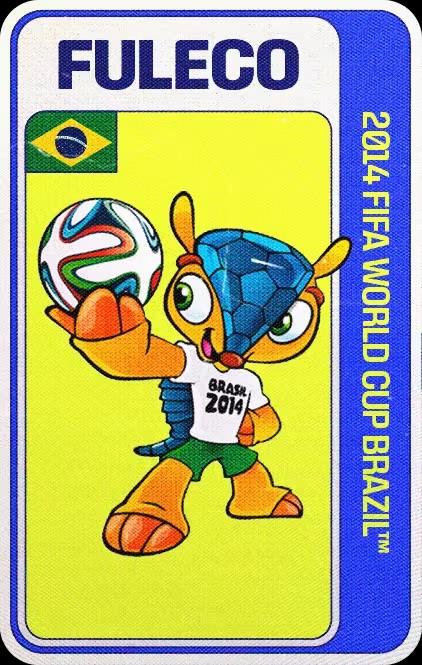Fuleco, mascota oficial del Mundial Brasil 2014, que representa un armadillo tatu bola antropomórfico de color naranja y caparazón azul con un patrón de hexágonos y pentágonos similar al de los balones de fútbol. Tiene un balón en la mano, el cual mira mientras la extiende para mostrarlo. Va vestido con pantalones cortos verdes y camiseta blanca con la leyenda "Brasil 2014"