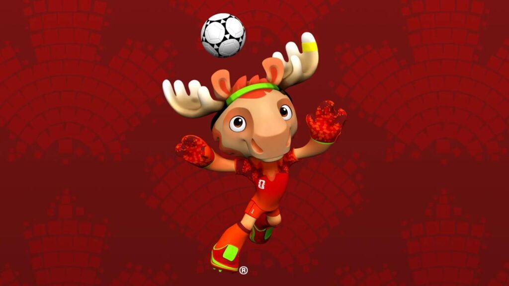 Maple, mascota oficial del Mundial de la FIFA, México, EE.UU., Canadá 2026, que representa a una alce canadiense antropomórfico y caricaturizado de forma digital vestido con una equipación roja con detalles verdes y guantes de portero, en posición de atajar un balón que se encuentra sobre su cabeza.